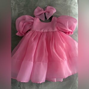 Barbie pink dress
Size 2y
Bow included